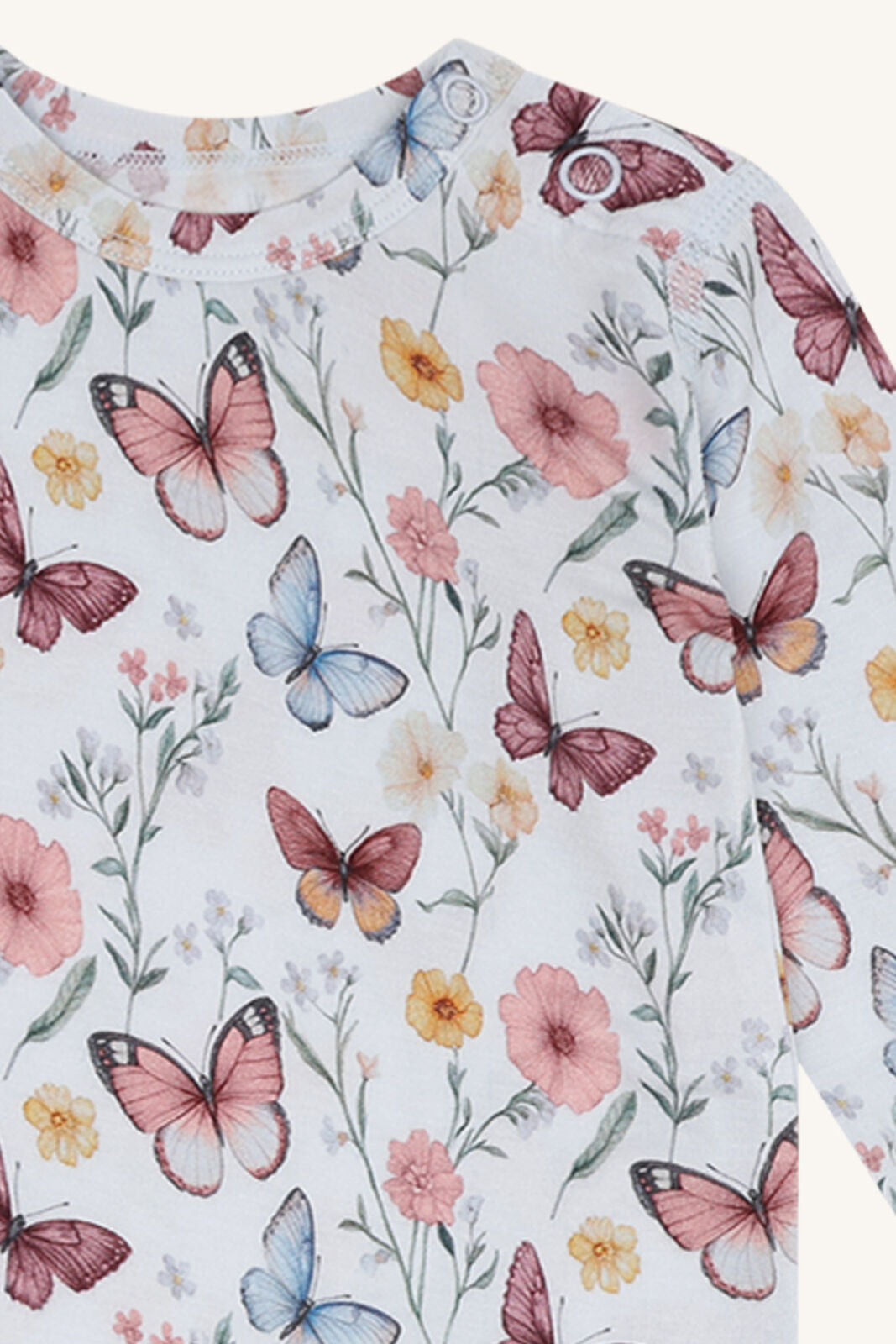 Detailansicht Hust&Claire Baby Body mit Schmetterlingsmuster im Bärechind Winterthur, Zürich, Schweiz