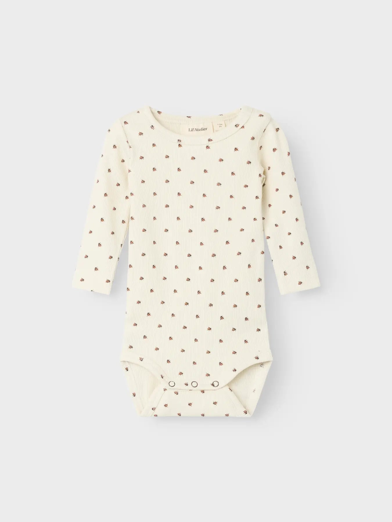 Langarm-Babybody mit Marienkäfer-Print aus TENCEL™ von Lil' Atelier – erhältlich bei Bärechind Winterthur.