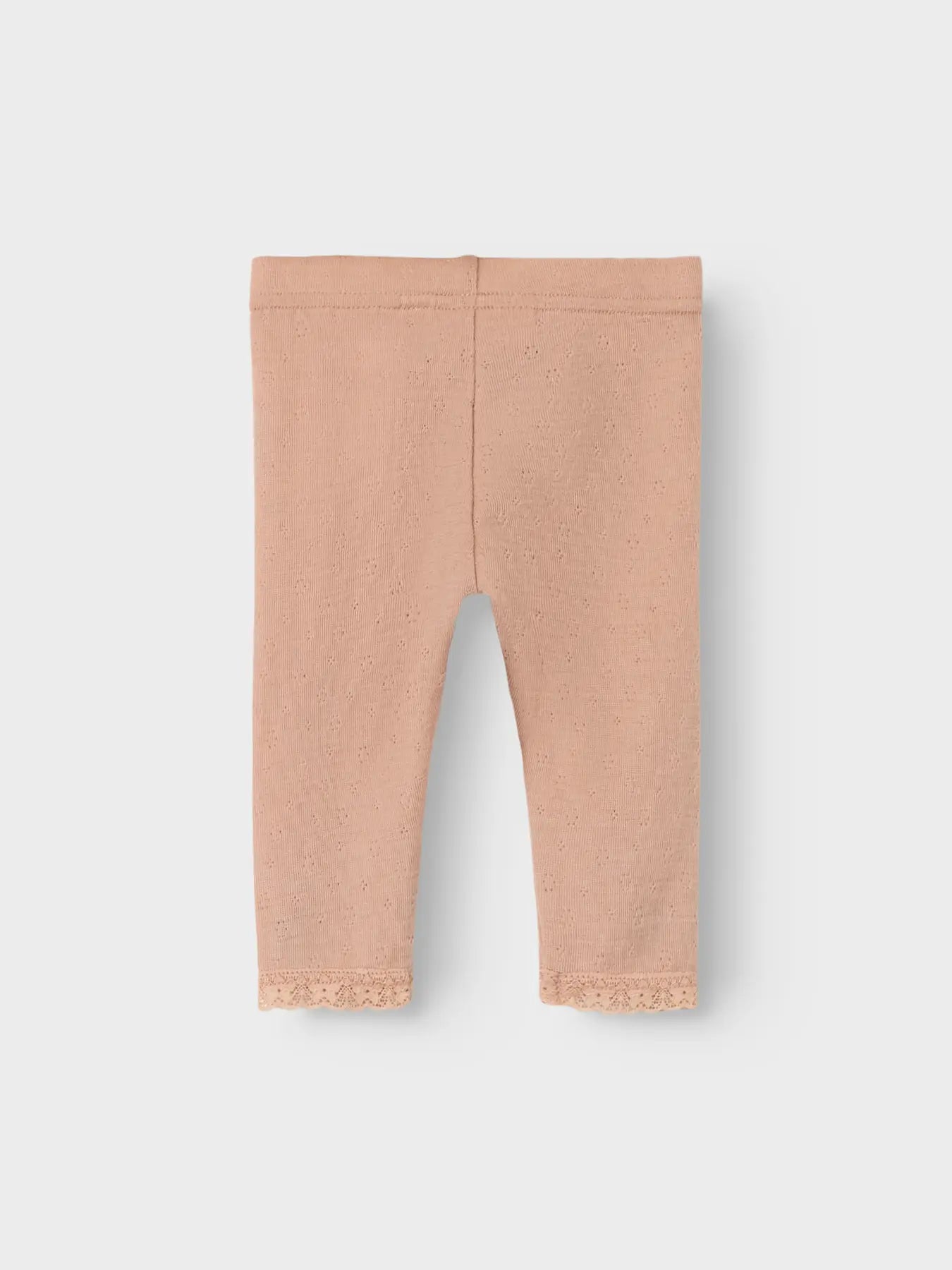 Rückansicht der beigen Merino-Leggings von Lil’Atelier mit zartem Lochmuster in Winterthur.