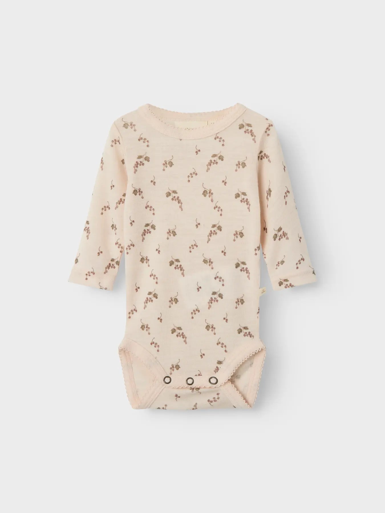 Dieser Langarmbody aus Wolle mit Traubenmuster von Lil’Atelier ist in Winterthur erhältlich.
