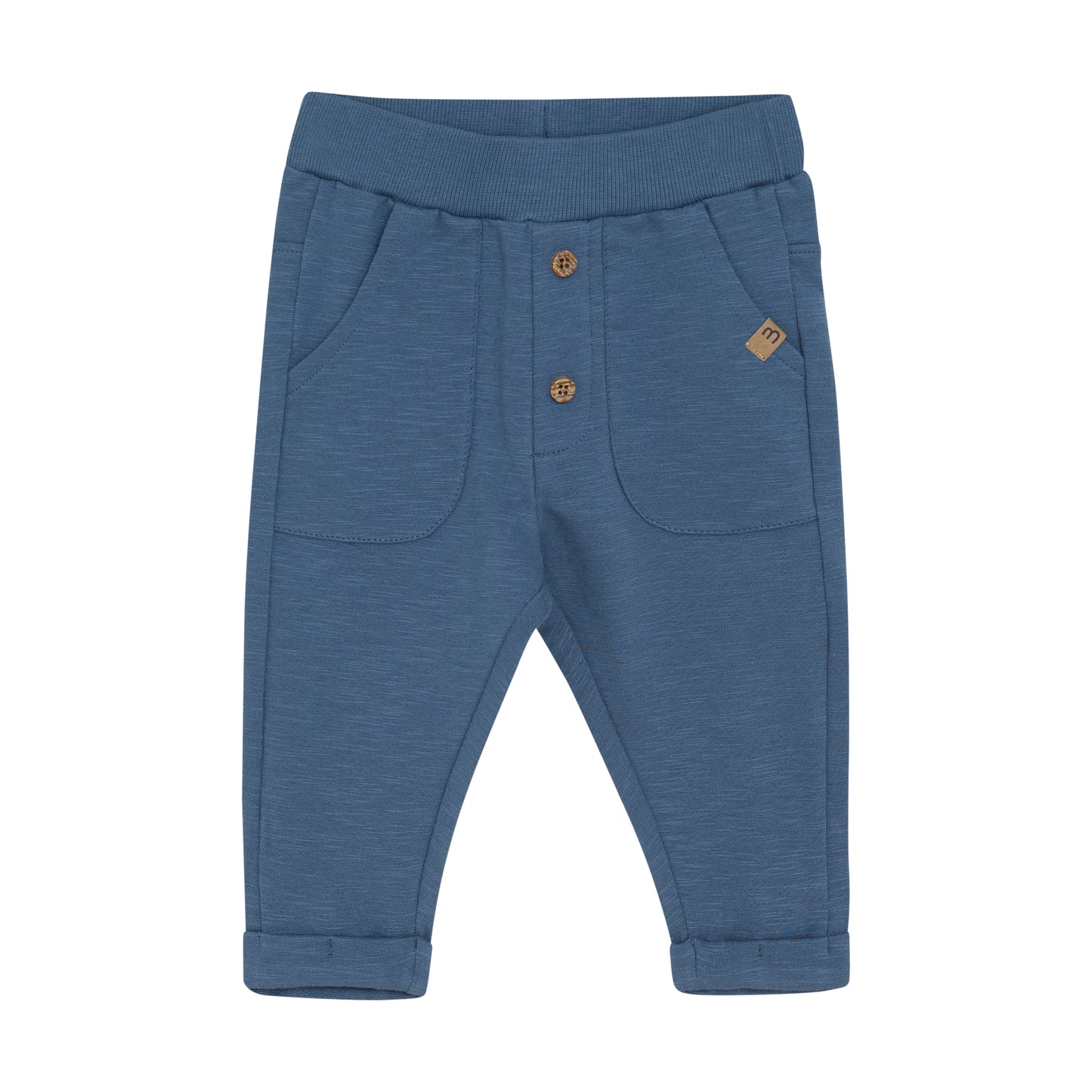Blaue MINYMO Babyhose aus Baumwolle mit Taschen und Holzknöpfen – erhältlich bei Bärechind in Winterthur, Zürich, Schweiz.