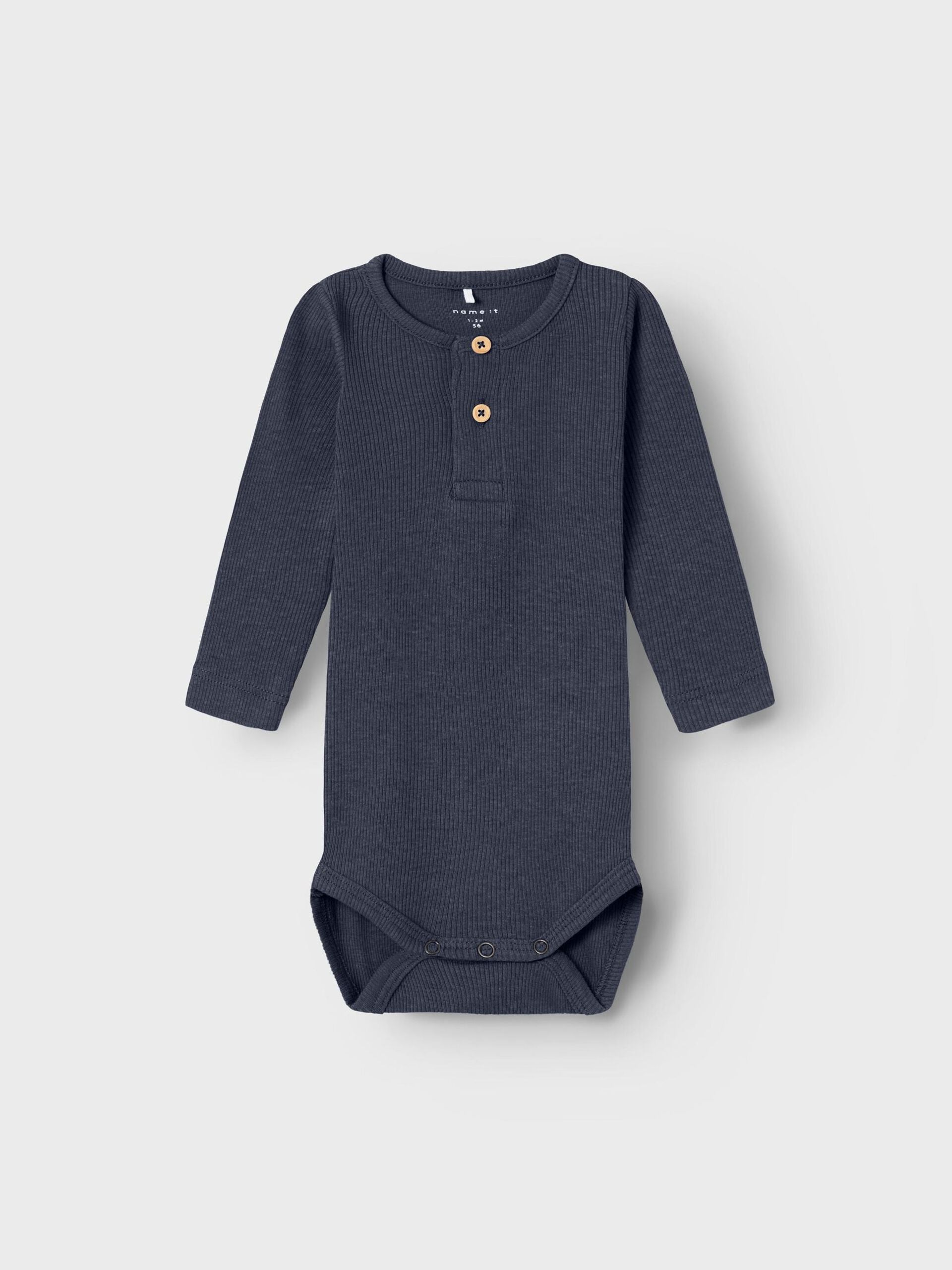 Alt-Text: Babybody aus Bio-Baumwolle in Vintage Indigo Melange, flachliegend. Zu kaufen bei Bärechind in Winterthur, Zürich Schweiz.