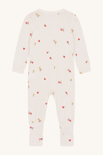 Rückansicht des Hust & Claire Mulle Stramplers mit floralem Allover-Muster und elastischen Bündchen.