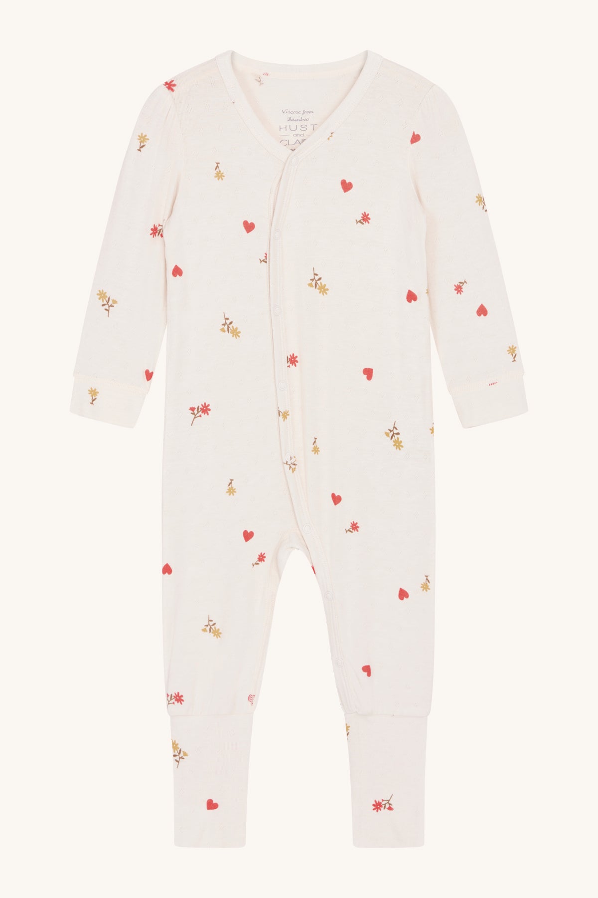 Vorderansicht des Hust & Claire Mulle Stramplers mit zartem Blumen-Print, aus weichem Bambusstoff.