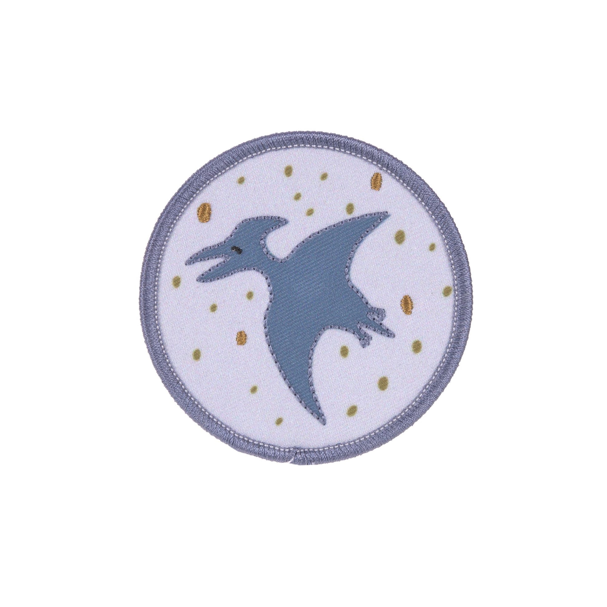 Runde Patch mit fliegendem Dinosaurier auf violettem Hintergrund aus dem Laessig Dinosaurier Set.