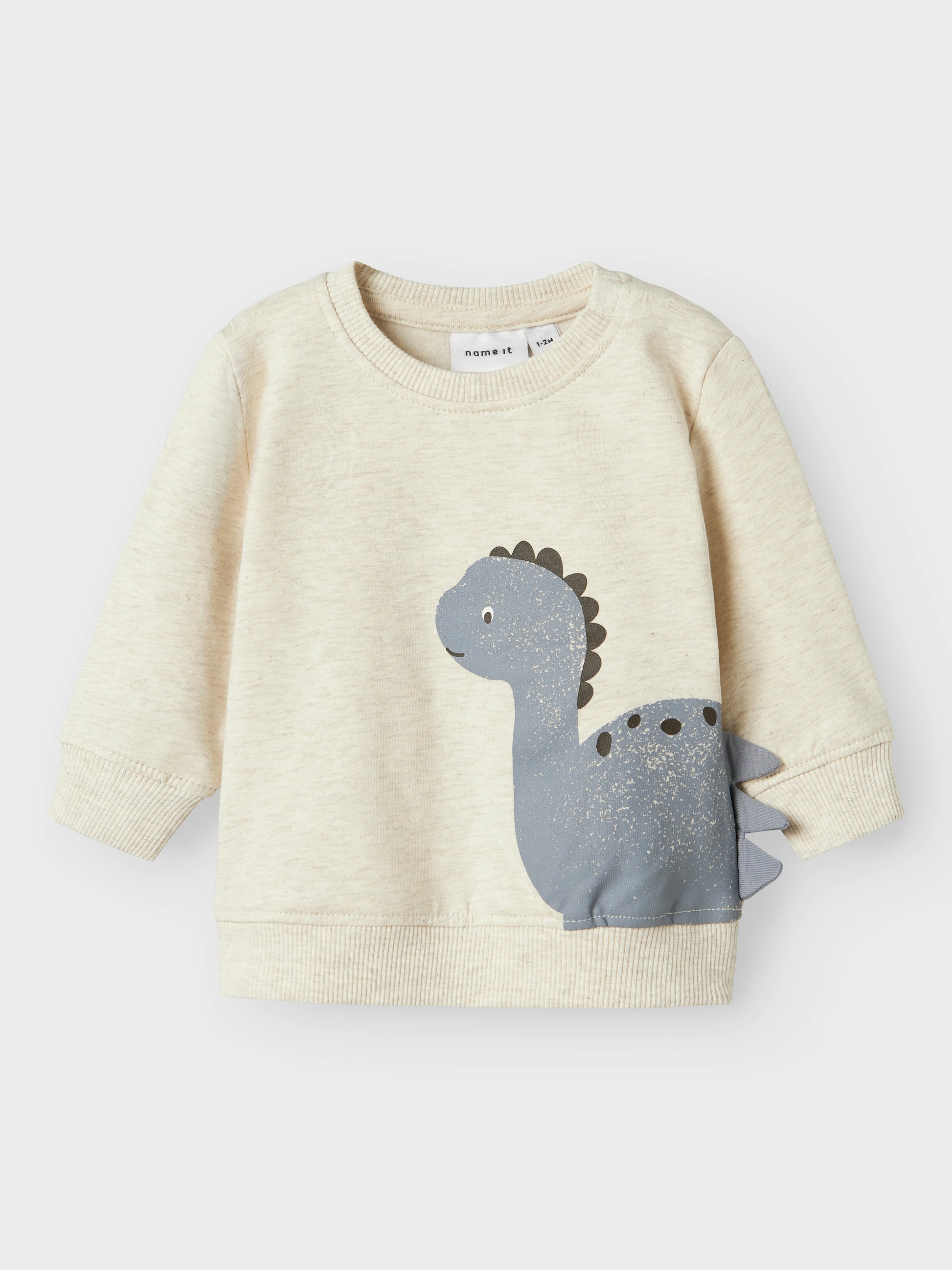 Beiges weich gefüttertes Baumwoll-Sweatshirt mit blauem Dino-Motiv für Kinder, Vorderansicht – Bärechind, Winterthur, Zürich Schweiz.