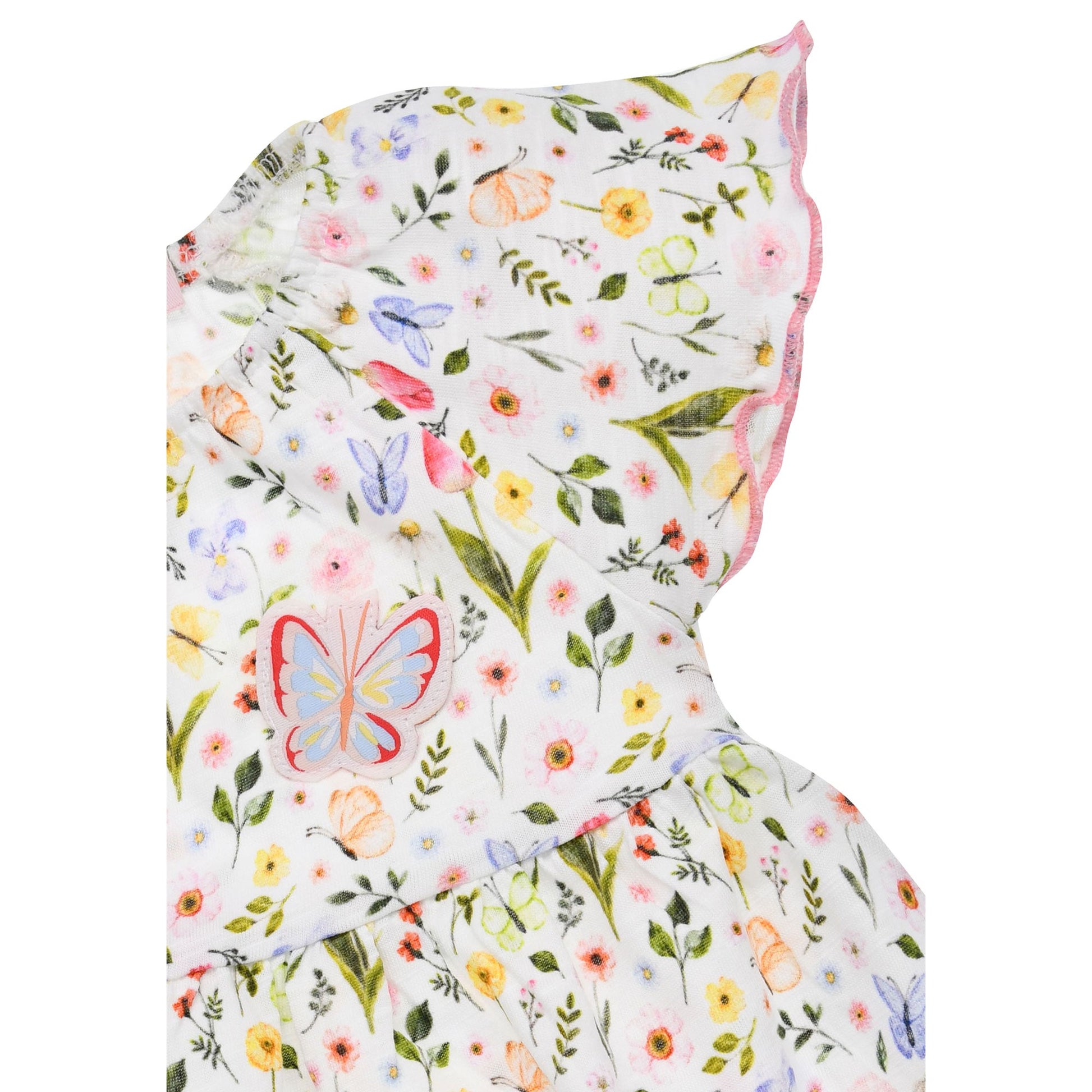 Rückseite vom Bondi Kinderkleid mit buntem Blumenmuster – online und im Bärechind Kinderladen in der Schweiz erhältlich.