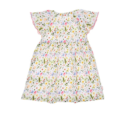 Seitliche Ansicht des Bondi Blumenkleids mit ausgestelltem Rock – erhältlich bei Bärechind, dem Kinderladen in Winterthur, Zürich, Schweiz.