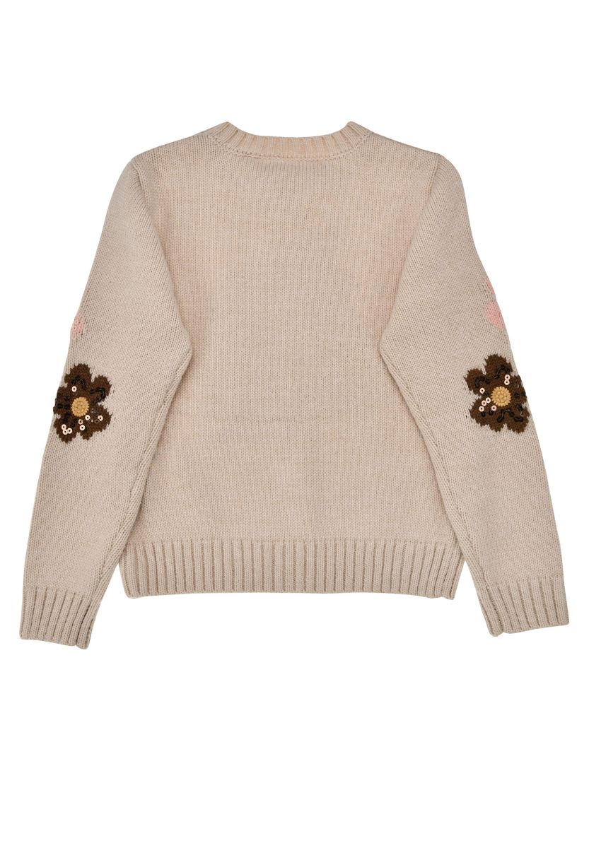 Rückseite des beigen Bondi Strickpullovers mit Pferdedetails an den Ärmeln bei Bärechind Winterthur Zürich Schweiz