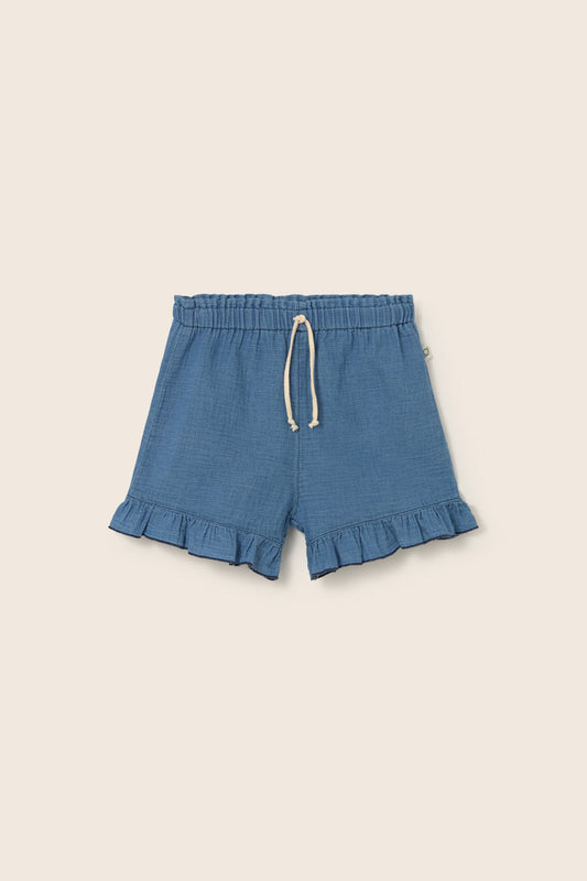 Blaue Kinder Shorts Isla aus Denim-Musselin mit Rüschen von Cozmo – nachhaltige Sommermode im Bärechind Winterthur