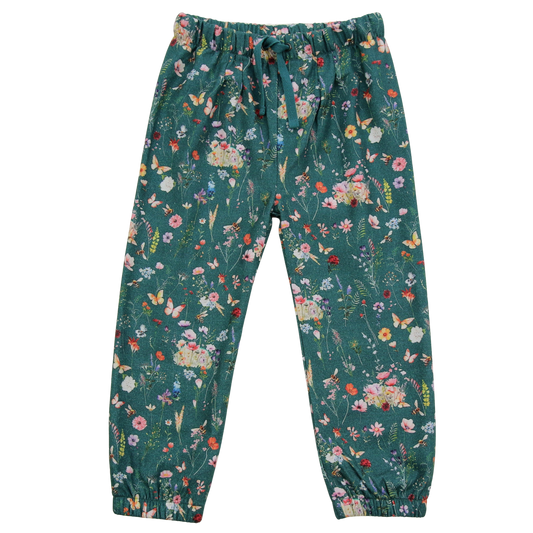 Gefütterte Kinderhose aus Baumwolle mit buntem Blumenmuster von Enfant Terrible, erhältlich bei Bärechind in Winterthur, Zürich Schweiz.