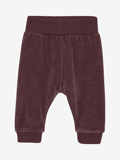 Fixoni Babyhose aus braunem Velours – nachhaltig & bequem, erhältlich bei Bärechind in Winterthur, Zürich, Schweiz