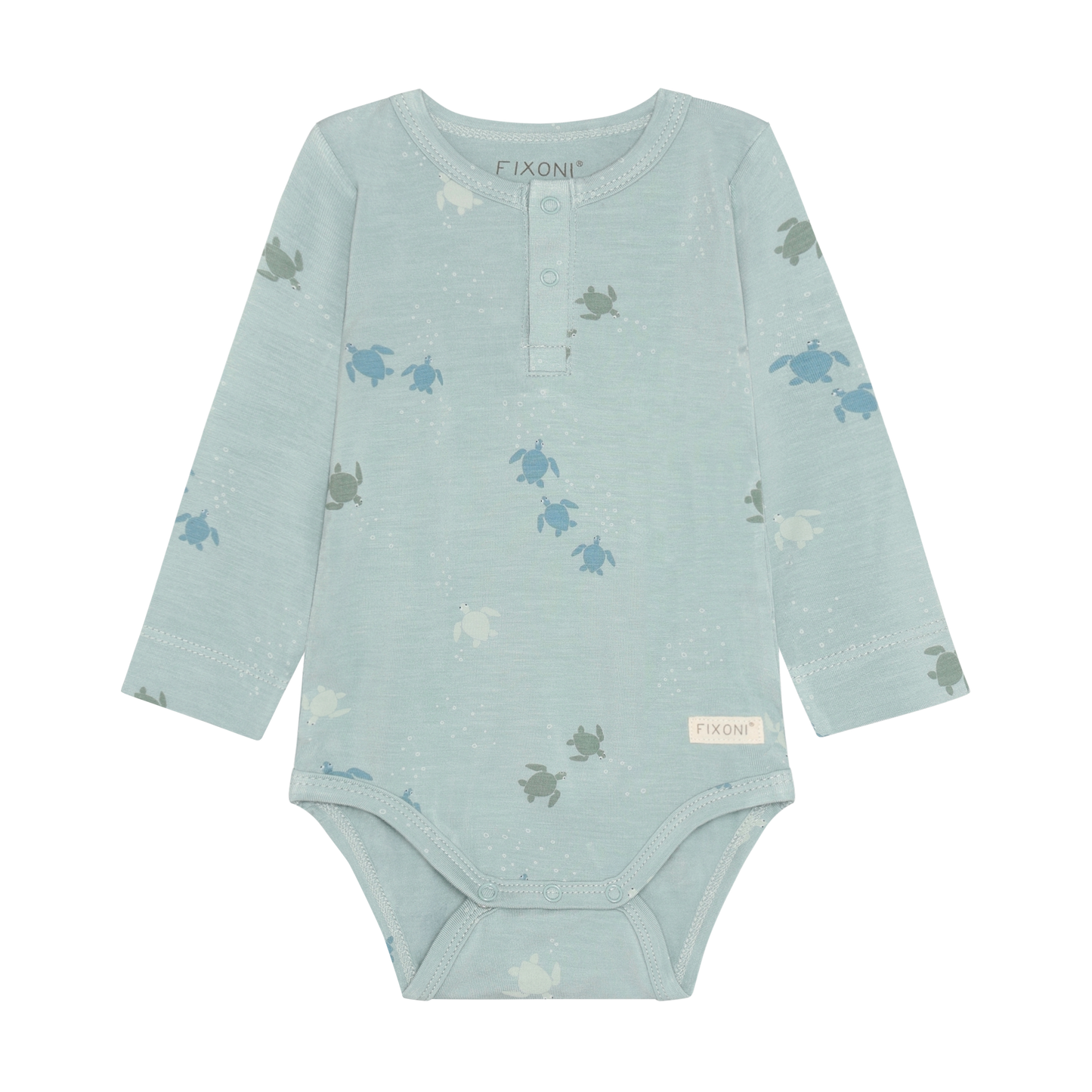 Baby trägt Fixoni Bambus Body mit Schildkröten Print aus dem Kinderladen Bärechind Winterthur Zürich Schweiz für nachhaltige Kinderkleider.