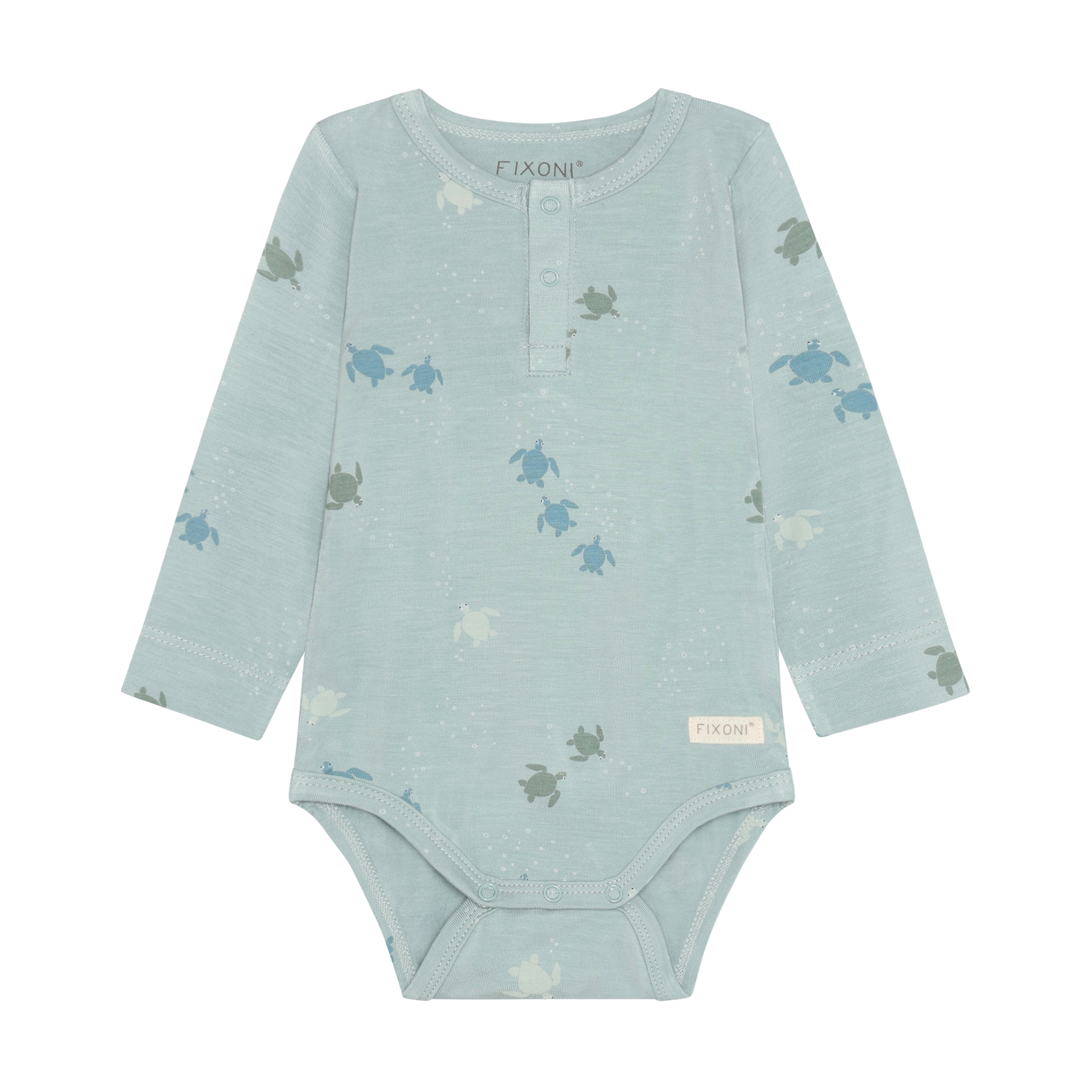 Baby trägt Fixoni Bambus Body mit Schildkröten Print aus dem Kinderladen Bärechind Winterthur Zürich Schweiz für nachhaltige Kinderkleider.