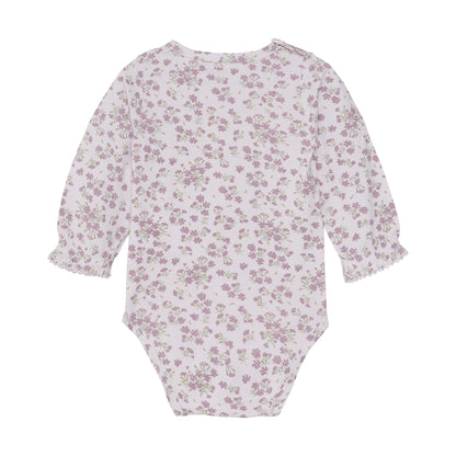 Rückansicht des Fixoni Baby-Bodys aus Bambus Viskose mit floralem Print