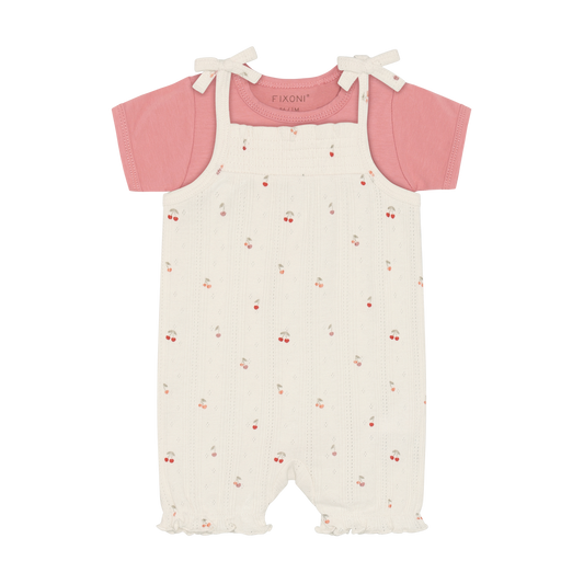 Fixoni Body und Strampler mit Kirschen aus Bio Baumwolle im Kinderladen Bärechind Winterthur Zürich Schweiz für nachhaltige Kinderkleider.