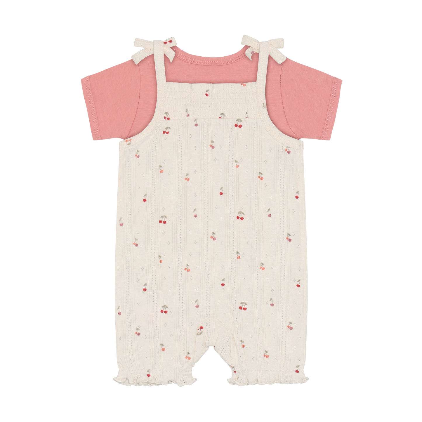 Fixoni Body und Strampler mit Kirschen aus Bio Baumwolle im Kinderladen Bärechind Winterthur Zürich Schweiz für nachhaltige Kinderkleider.