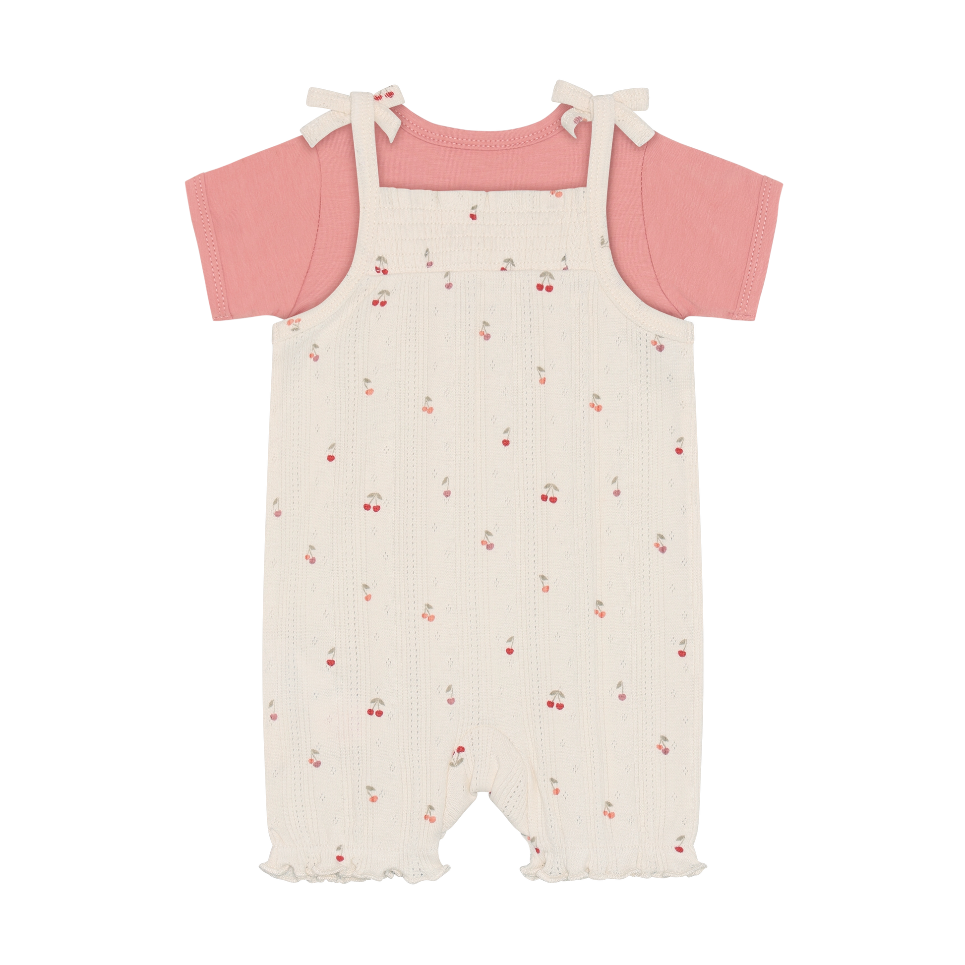 Fixoni Body und Strampler mit Kirschen aus Bio Baumwolle im Kinderladen Bärechind Winterthur Zürich Schweiz für nachhaltige Kinderkleider.