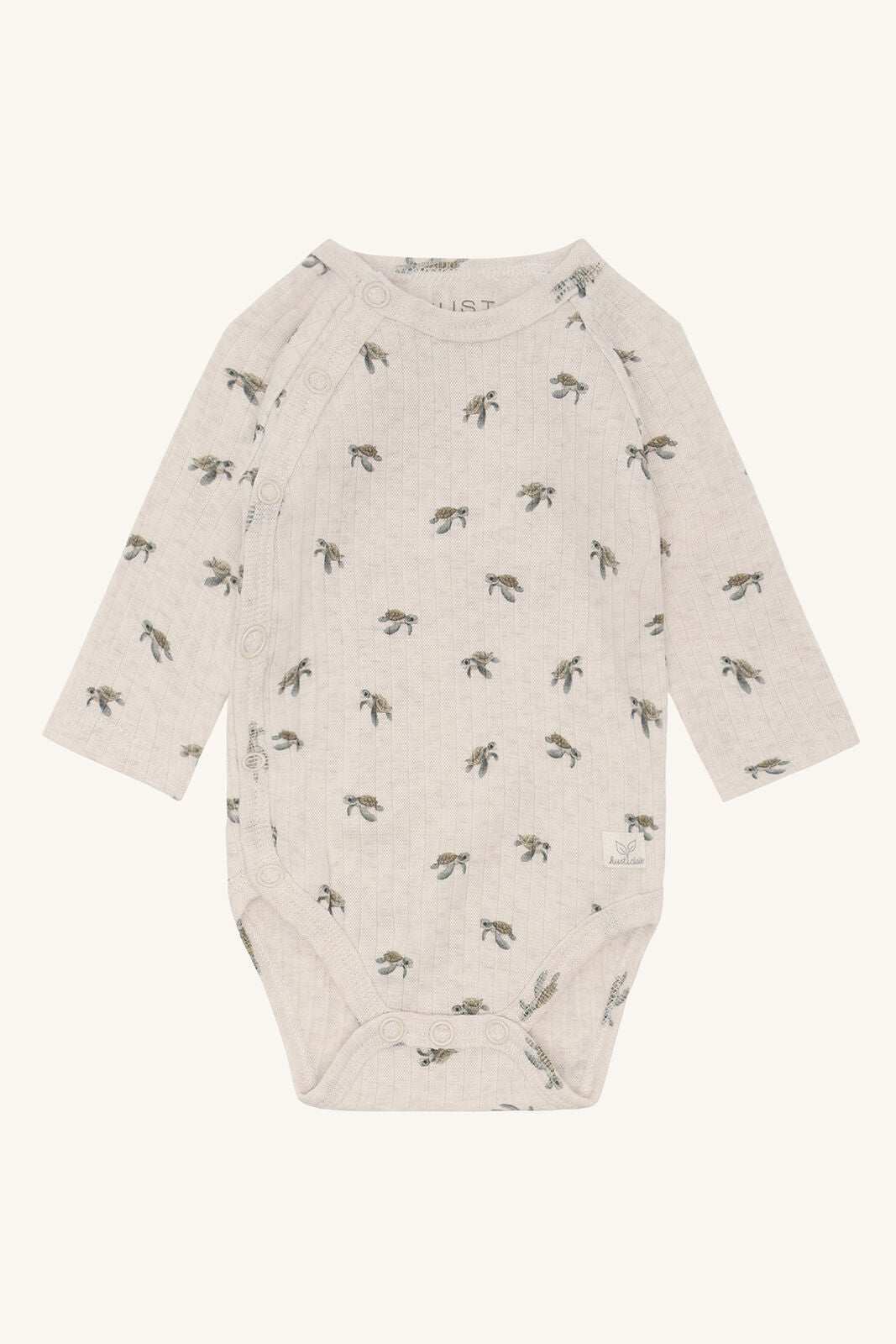 Hust&Claire Bing Wickelbody aus GOTS zertifizierter Baumwolle mit Schildkrötenprint, Vorderansicht, im Bärechind Winterthur Zürich Schweiz.