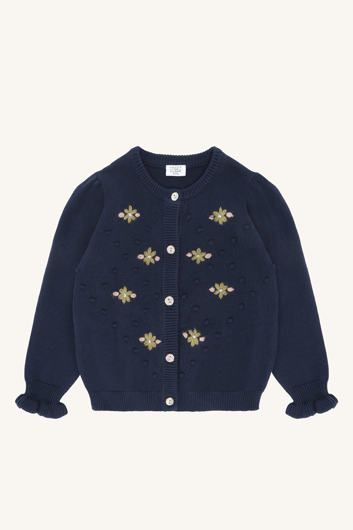 Dunkelblaue Strickjacke Camilia von Hust&Claire mit grünen Blumenstickereien und 3D-Strickdetails, erhältlich im Bärechind Winterthur, Zürich Schweiz.