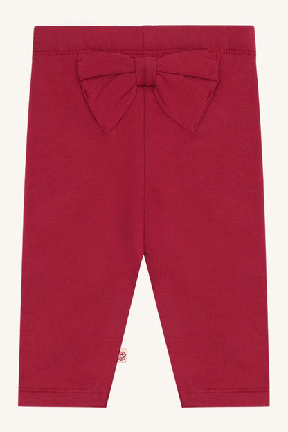 Hust & Claire Lisa Baby Leggings in Teaberry mit grosser Schleife auf der Rückseite. Babykleider im Bärechind Winterthur, Zürich, Schweiz.