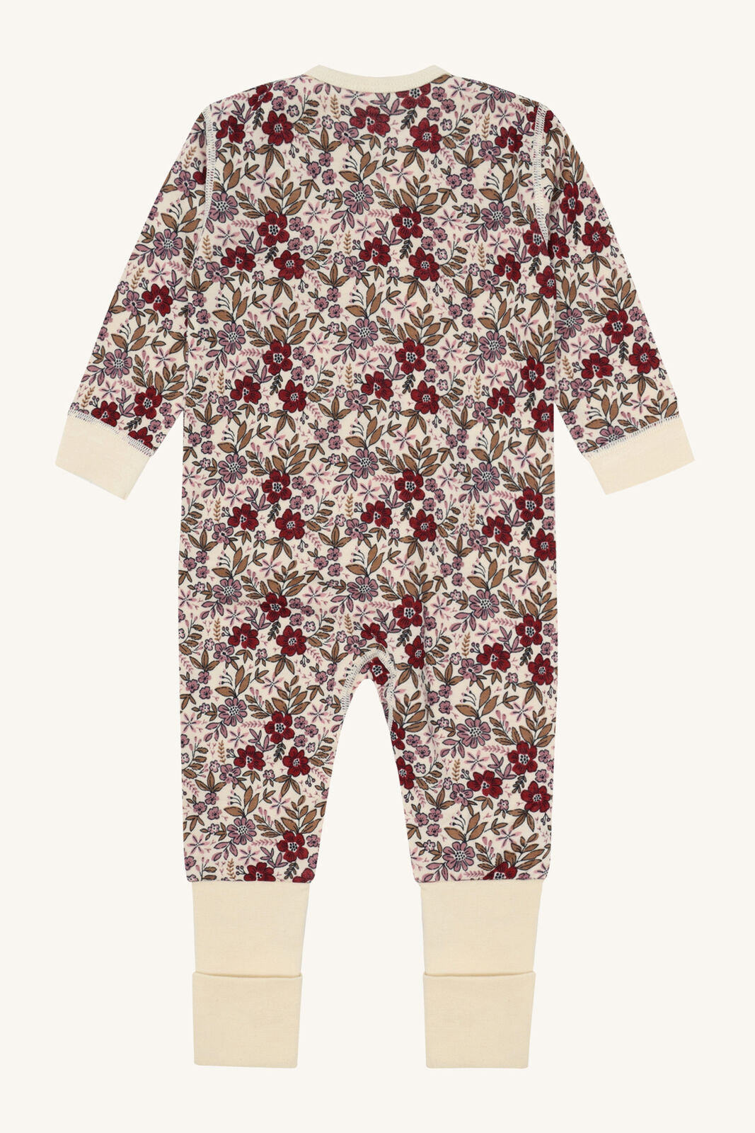 Rückansicht des Hust&Claire Manu Stramplers aus Merinowolle und Bambus mit Blumenprint, Bärechind Winterthur Zürich Schweiz.