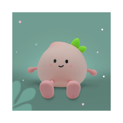 LED Nachtlicht in Form eines Pfirsichs aus Silikon, leuchtend im Kinderzimmer, erhältlich im Bärechind Winterthur Zürich Schweiz.