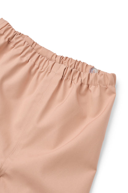 Detailansicht der Hose vom Liewood Pedia Regenanzug in Berry Pale Tuscany – gesehen bei Baerechind Winterthur.