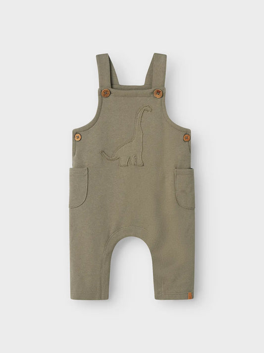 Latzhose von Lil' Atelier mit Dino-Stickerei aus Bio-Baumwolle – erhältlich bei Bärechind Winterthur.