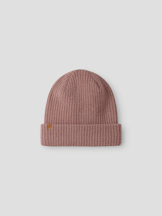 Flachliegende rosa Kindermütze aus 100 % Wolle von Lil'Atelier – Bärechind in Winterthur, Zürich Schweiz.