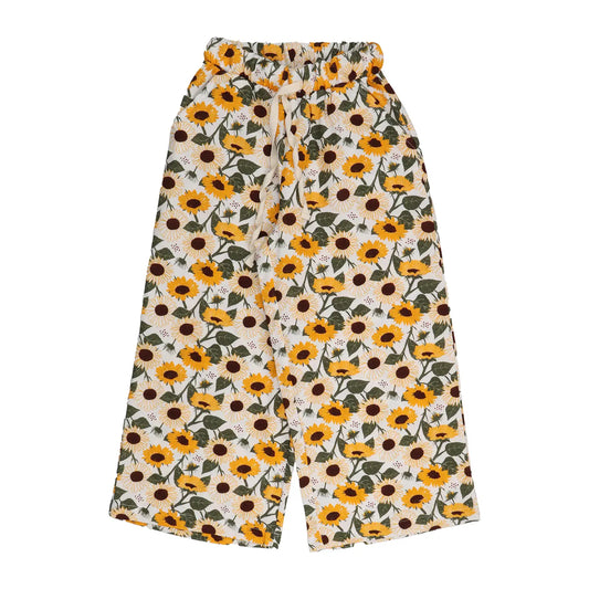 Nachhaltige Muslin-Kinderhose mit Sonnenblumen-Print, aus Bio-Baumwolle, ideal für den Sommer.