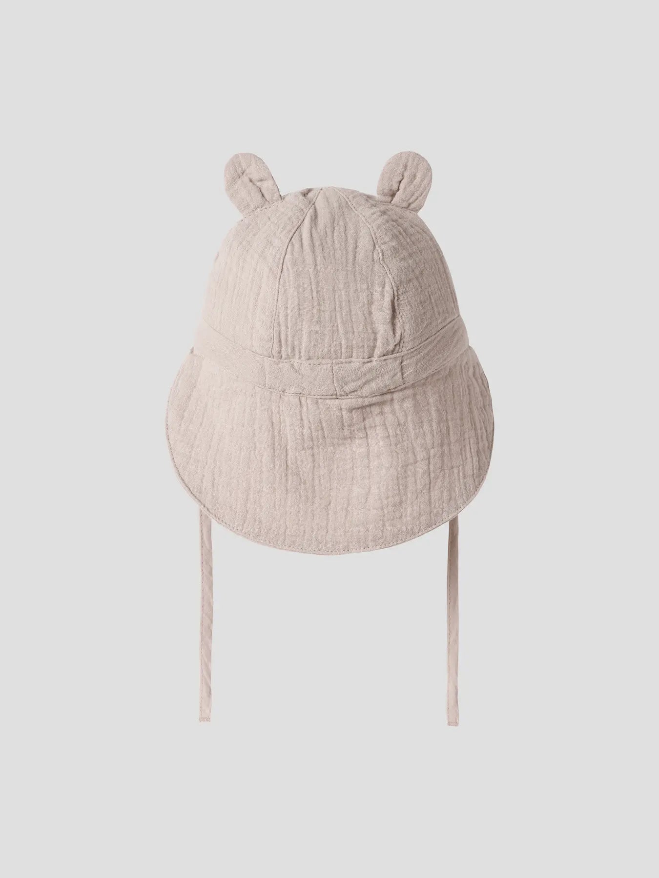 Rückansicht Musselin Baby Mütze aus Baumwolle in Beige zu kaufen im Bärechind Winterthur Zürich Schweiz.