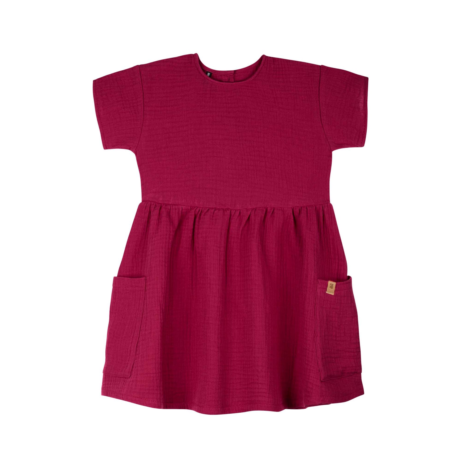 Musselin Kleid in Beere aus Baumwolle mit Taschen für Kinder – nachhaltig bei Bärechind Winterthur Schweiz.