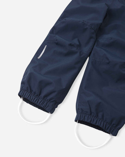 Fussschlaufen aus Silikon an der Reima Kaura Regenhose Navy