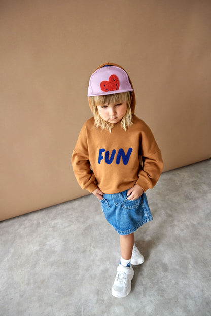 Kind trägt die Skater Cap „Heart lavender“ von Lässig – fröhlich & funktional