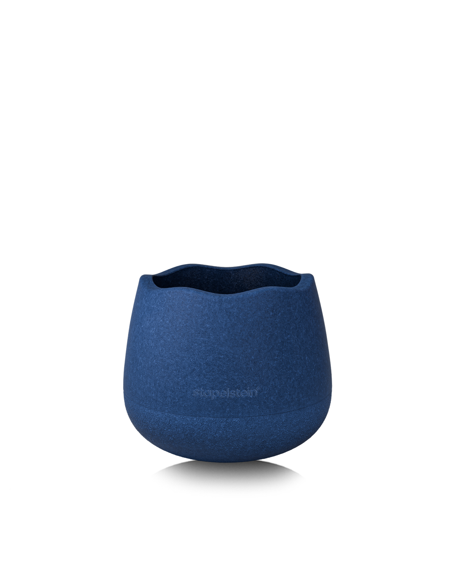 Dunkelblauer Schaumstoff-Hocker ohne Deckel, als offene Spiel- oder Aufbewahrungsschale.