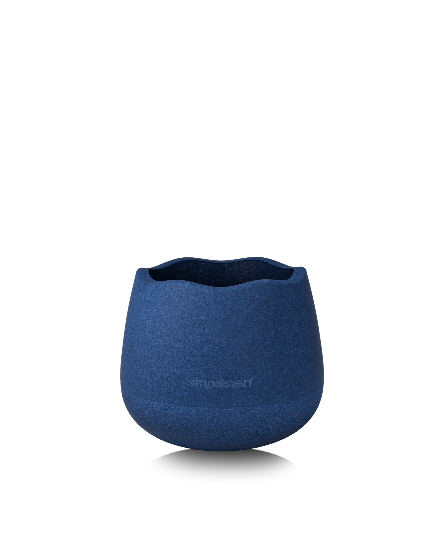 Dunkelblauer Schaumstoff-Hocker ohne Deckel, als offene Spiel- oder Aufbewahrungsschale.