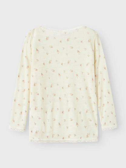 Rückansicht eines Langarmshirts aus 100% Wolle mit Blumenprint – zu kaufen bei Bärechind in Winterthur, Zürich, Schweiz.